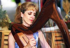 A woman plays a harp, Lemonade Concert and Art Fair, St. Cloud State University