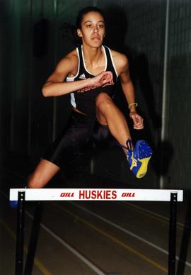 Track runner Danielle Simons jumps over hurdles, St. Cloud State University