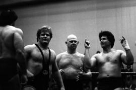 Wrestlers Brad Rheingans, Baron Von Raschke, and Steve Olsonowski prepare for their match at Halenbeck Hall, St. Cloud State University