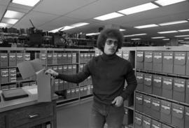 Graduate student James Roback in the Central Minnesota History Center, St. Cloud State University