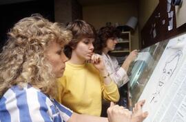 Women work on putting the Chronicle newspaper together, St. Cloud State University