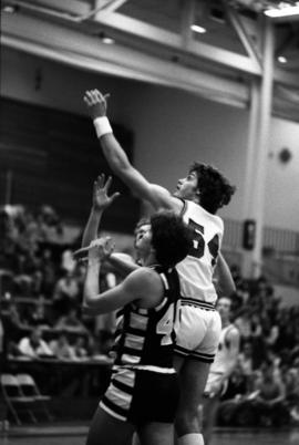 St. Cloud State University basketball player Dan Hagen looks for a rebound during a game against the University of Minnesota-Duluth