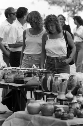 People walk past art vendors, Lemonade Concert and Art Fair, St. Cloud State University