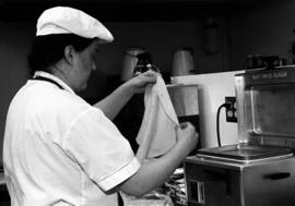 Woman makes a burrito at Bravo Burritos