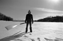 Scott Campbell stands on the frozen Mississippi River, St. Cloud State University