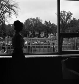 A student watches the construction of Case Hall (1964), St. Cloud State University