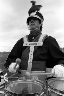 Marching band member plays the drums, St. Cloud State University