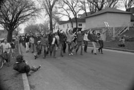 Protestors march on the street, Day of Peace protest, St. Cloud State University