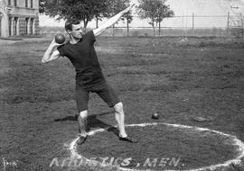 Bill Owens prepares to throw a shotput, St. Cloud State University