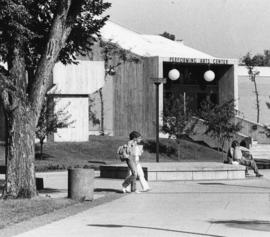 Students walk past the Performing Arts Center (1968), St. Cloud State University