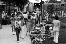 People walk past art vendors, Lemonade Concert and Art Fair, St. Cloud State University