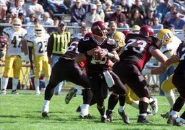 Keith Heckendorf plays quarterback during a football game against Augustana College, St. Cloud State University