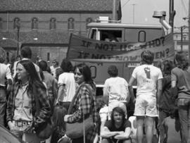Protestors gather on a sidewalk, Day of Peace protest, St. Cloud State University