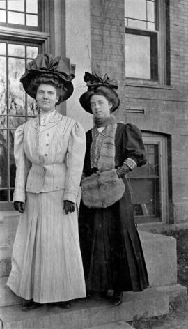 Kavennaugh and Johnson stand in front of Lawrence Hall (1905), St. Cloud state University