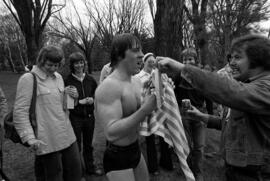 Curt Quiner dries off after swimming across the Mississippi River, St. Cloud State University