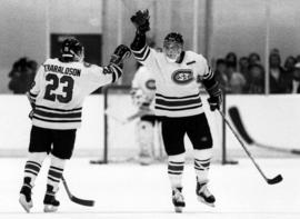 Two hockey players celebrate, St. Cloud State University