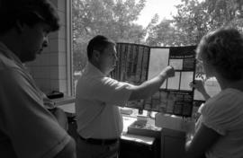 J. Brent Norlem shows students how to lay out a page of a newspaper, Mass Communication workshop, St. Cloud State University