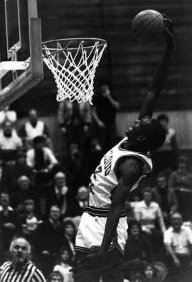 Basketball Kevin Catron dunks a basketball during a game, St. Cloud State University