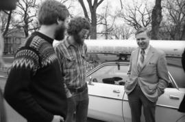 Dennis Caneff and Rolf Hagberg talk to Charles Graham as they leave campus for their Mississippi River canoe journey, St. Cloud State University