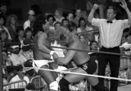 Million Dollar Man Ted DiBiase hits Tito Santana during a wrestling match at Halenbeck Hall (1965), St. Cloud State University