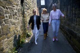 Three women walk together, Alnwick Castle, St. Cloud State University