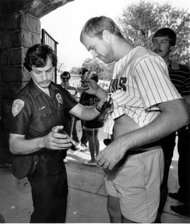 A student is searched before a football game at Selke Field, St. Cloud State University