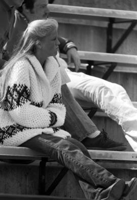 A woman watches the St. Cloud State University baseball game against Southwest State University