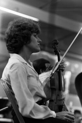 A Minnesota Orchestra musician waits to perform, Lemonade Concert and Art Fair, St. Cloud State University