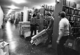 People moving booksﾠ for move to Centennial Hall (1971), Kiehle (1952), St. Cloud State University