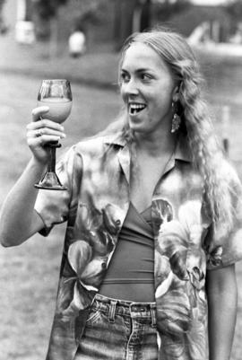 Woman enjoys a drink, Lemonade Fair, St. Cloud State University