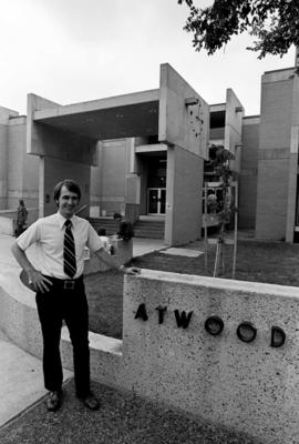 Gary Bartlett stands outside of Atwood Memorial Center (1966), St. Cloud State University