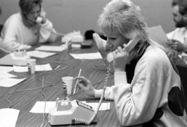 A woman talks on a telephone, KVSC trivia weekend, St. Cloud State University