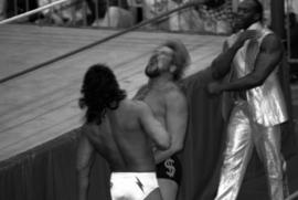 Tito Santana hits the Million Dollar Man Ted DiBiase while Virgil looks on during at wrestling match at Halenbeck Hall (1965), St. Cloud State University