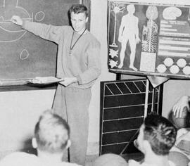 Basketball coach Ken Novak diagrams a play, St. Cloud State University