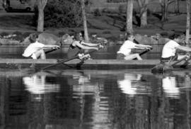 Rowing Club members row a boat, St. Cloud State University