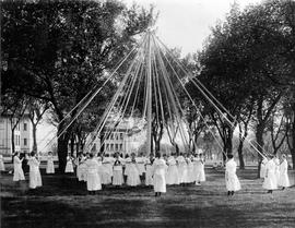 Female students gather and march around a May Pole, St. Cloud State University