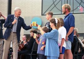 People toast together, Lemonade Fair, St. Cloud State University