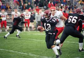 Quarterback Keith Heckendorn runs with the ball against the University of South Dakota, St. Cloud State University