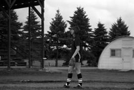 Woman softball player readies to pitch a softball in a game against Winona State, St. Cloud State University