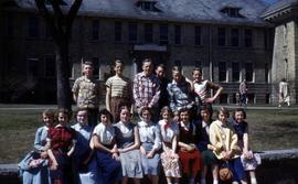 Students stand in front of Riverview (1913), St. Cloud State University