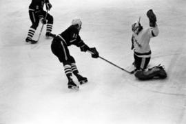 St. Cloud State hockey player Steve Martinson tries to score during a game with St. John's University