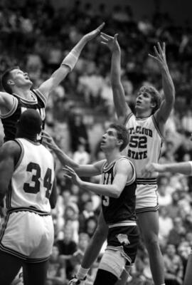 Phil Mann takes a shot during a basketball game against North Dakota State University, St. Cloud State University