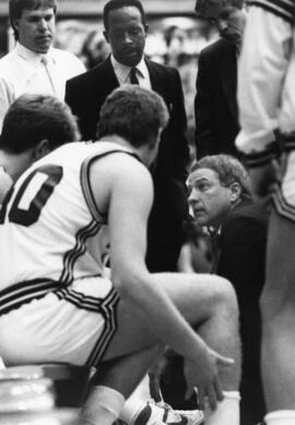 Willie Myles with basketball head coach Butch Raymond during a game, St. Cloud State University