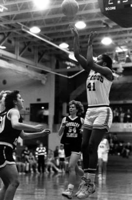 Toni Jameson shoots a basketball, St. Cloud State University