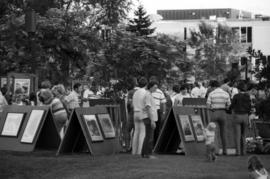 People walk past art vendors, Lemonade Concert and Art Fair, St. Cloud State University