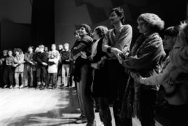 Audience comes up on stage in the Stewart Hall (1948) auditorium to sing "We Shall Overcome" at the Martin Luther King Jr. birthday celebration, St. Cloud State University