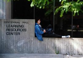 Student waits outside of Centennial Hall (1971), St. Cloud State University