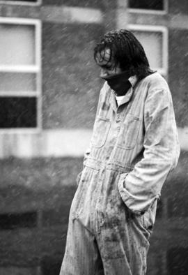 Geoff Hibbison watches in a snowy football game, St. Cloud State University