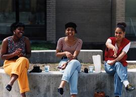 Three students sit together and eat lunch, St. Cloud State University