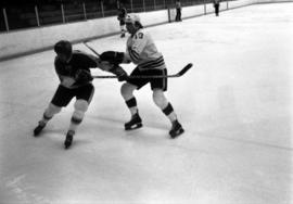 St. Cloud State hockey player Steve Martinson battles against an opponent during a game with Iowa State University